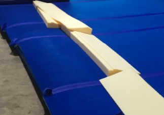 Tapered sprung floor edging